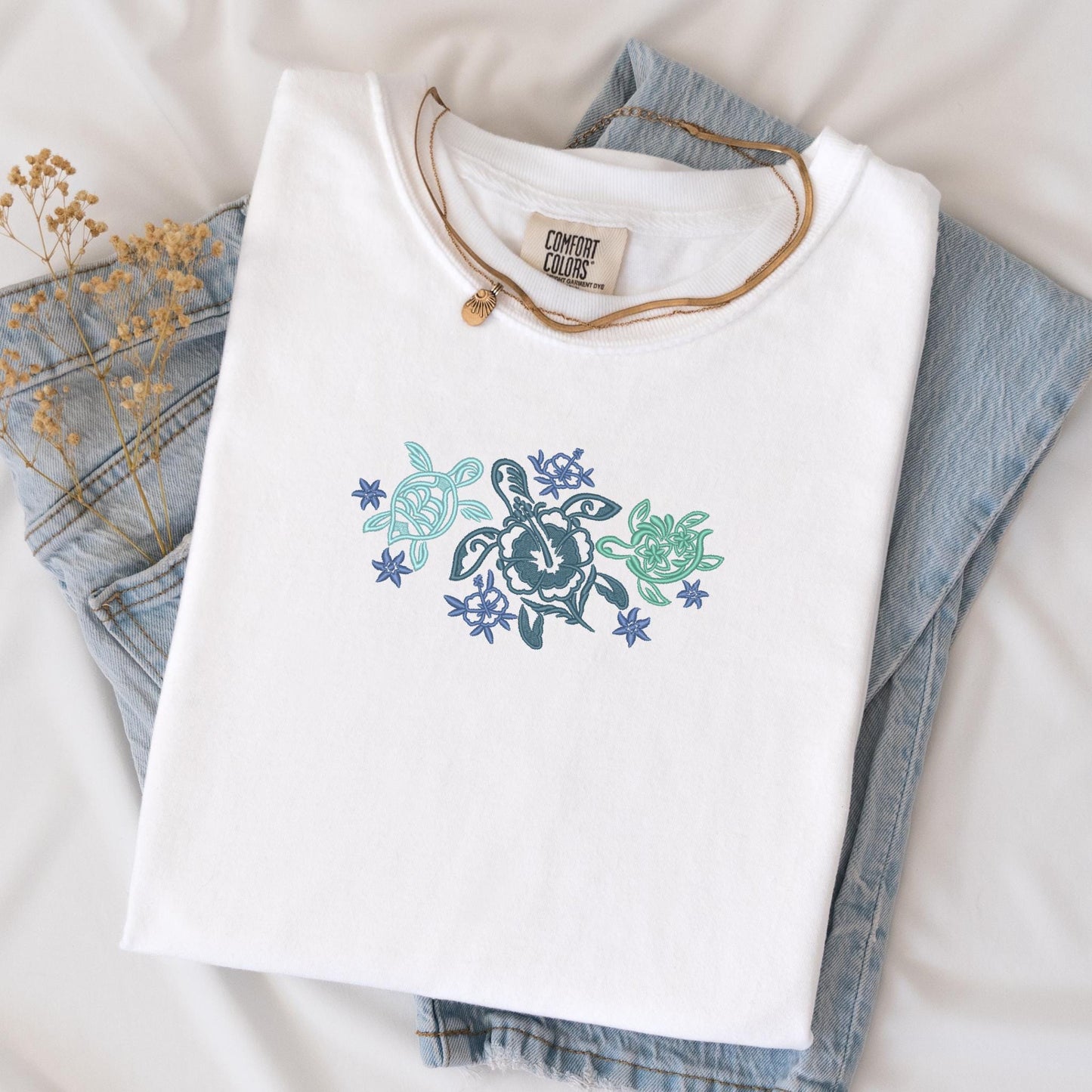 a pair of jeans and a t - shirt with a turtle on it