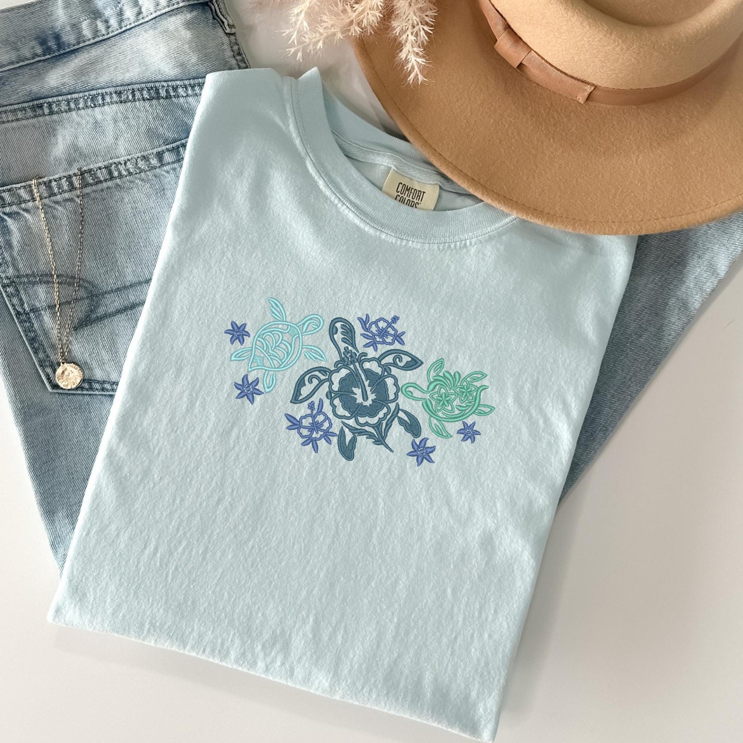 a pair of jeans, a hat and a t - shirt
